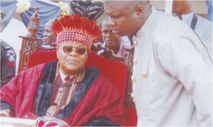 FRED06051102 Amayanabo of Opobo Kingdom, King Dandeson Jaja (left) chatting with newly elected member of House of Representatives, Hon Dakuku Peterside, during the duistingushed citizens Honorary Awards at Opobo Town, recently.