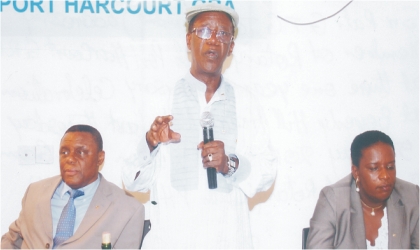 District Governor, Rotary International 9140, Sir Gabriel Toby (standing), President, Rotary Club of Port Harcourt, GRA, Prof Wilson Bellgam (left) and a female Rotarian during the one year anniversary celebration of the Rotary Club of Port Harcourt, GRA in Port Harcourt, last Thursday