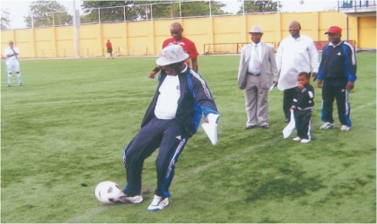 FRED11051103 Representative of Head of Service, Esther Anucha, Permanent Secretary of Establishment, Training & Pension, Mr Gift Ake kicking off the 2011 Rivers Head of Service Cup competition at the Sharks Stadium, Port Harcourt.