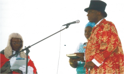 Governor of Rivers State, Rt Hon Chibuike Rotimi Amaechi with his wife, Dame Judith,  taking oath of office during the swearing-in ceremony at Liberation Stadium, last Sunday