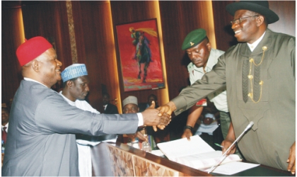 FRED01061102 President Goodluck Jonathan (right) congratulating the new Secretary to the Government of the Federation, Sen. Anyim Pius Anyim, after swearing him-in, in Abuja, yesterday.