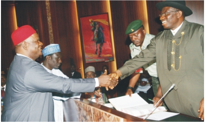 President Goodluck Jonathan (right) congratulating the new Secretary to the Government of the Federation, Sen. Anyim Pius Anyim, after swearing him-in, in Abuja, yesterday.