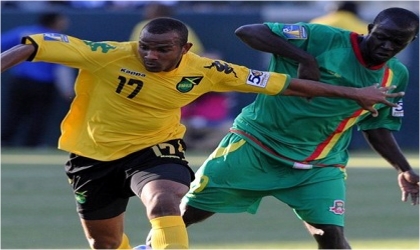 FRED08061103 Jamaica and Grenada players during the second day of the CONCACAF Gold Cup competition, yesterday