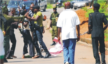 Security men arresting students of Plateau State Polytechnic and College of Education who are protesting over strike  by their lecturers for the past eight months in Jos, yesterday