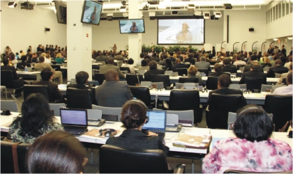 FRED13061103 Audience listening to a 12-year old Nigerian girl, Ebubechukwu Taylor, addressing World Leaders at the launch of a global plan for the elimination of new infections among children and keeping their mothers alive at the UN Headquarters in New York.