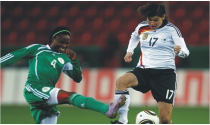 FRED29061103 Perpetua Nwkocha in action against an opponent during an outing