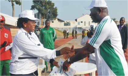 Special Guest of Honour/Comptroller General of Immigrations, Mrs Roseline Uzoma (left), presenting a prize to the Chief of Army Staff, Lt.-Gen. Azubuike Ihejirika, after a novelty football match to mark 2011 Army Day celebration in Abuja, yesterday
