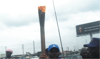 The 17th National Sports Festival Torch, shortly on arrival from Abia State, yesterday. Governor Chibuike Amaechi will formally receive the torch today in Port Harcourt.