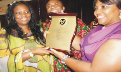 FRED03071102 Wife of Rivers State Governor, Dame Judith Amaechi (left) with Nigeria's Consular-General, State of Georgia, Hon. Geoffrey Teneilabe, shortly after receiving an award of excellence in Atlanta Georgia, United States of America.