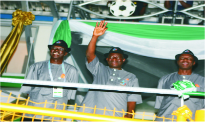 President Goodluck Jonathan acknowledging cheers during the parade by participating states at the Garden City Games, yesterday. He is flanked byRivers State Governor, Rt Hon Rotimi Amaechi (right) and the Director-General, National Sports Commission, Chief Patrick Ekeji. Photo: Chris Monyanaga