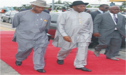 FRED05071101 President Goodluck Jonathan (middle) and Rivers State Governor, Rt. Hon. Chibuike Rotimi Amaechi (left) stepping out, shortly after arriving for the opening ceremony of the 17th National Sports Festival, in Port Harcourt, on Sunday.