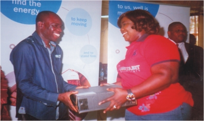 Rivers State Commissioner for Information and Communications, Mrs Ibim Semenitari presenting a laptop to Mr Nelson Chukwudi of The Tide Newspapers, during the Capacity Building/ICT Infrastructure to journalists by ExxonMobil in collaboration with Rivers State Council of the Nigeria Union of Journalists (NUJ), in Port Harcourt, yesterday