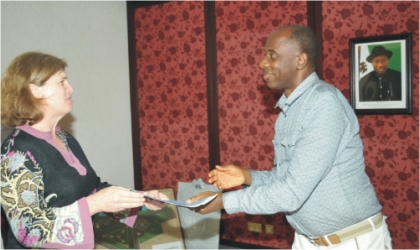 Rivers State Governor, Rt Hon Chibuike Amaechi  receiving  an address from team leader Violaine Mitchel of Bill and Melinda Gates Foundation, USA, on behalf of Global Alliance on Vaccines and Immunisation (GAVI), during a courtesy visit to Government House, Port Harcourt, yesterday.