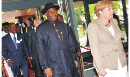 FRED15071103 From Left: Gov. Emmanuel Uduaghan of Delta State; President Goodluck Jonathan; and Chancellor of the Federal Republic of Germany,, Dr Angela Merkel, arriving for the 4th German-Nigeria Business Forum in Abuja, yesterday