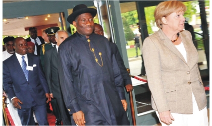 From Left: Gov. Emmanuel Uduaghan of Delta State; President Goodluck Jonathan; and Chancellor of the Federal Republic of Germany,, Dr Angela Merkel, arriving for the 4th German-Nigeria Business Forum in Abuja, yesterday