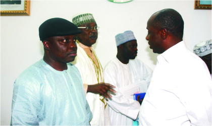 FRED18071101 Rivers State Governor, Rt Hon. Chibuike Rotimi Amaechi and Chairman of Governors Forum (right) chatting with Edo State Governor, Dr Emmanuel Uduaghan (left) and other governors, during a meeting of the forum, held in Abuja, at the weekend.