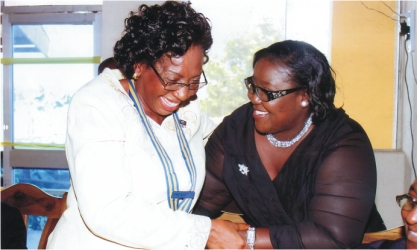 FRED15081103 ; Rivers State Information and Communications Commissioner, Mrs Ibim Semenitari (right) chatting with Rotarian Georgiana Ngeri-Nwagha, immediate past President, Rotary Club of Port Harcourt, during induction of the club’s new president, on Saturday. Photo: Chris Monyanaga