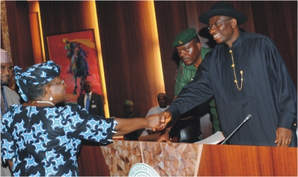 FRED19081101 Dr Ngozi Okonjo-Iweala , Minister of Finance being congratulated by President Goodluck Jonathan after taking her oath of office in Abuja last Wednesday