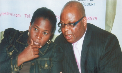 Director and Founder of Rainbow Book Club, Mrs Koko Kalango listening to Dr Williams Wodi, Head of Public Relations at the University of Port Harcourt, during a press conference to mark the 2011 Garden City Interary Festival at Le Meridien Hotel in Port Harcourt. The festival holds from 12th-17th Sept.  Photo: Chris Monyanaga