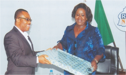 FRED26081102 Rivers State Commissioner for Information and Communications, Mrs Ibim Semenitari receiving a present from the General Manager, Rivers State Newspaper Corporation, Mr Celestine Ogolo, when she visited The Tide Newspapers, yesterday. Photo: Dele Obinna