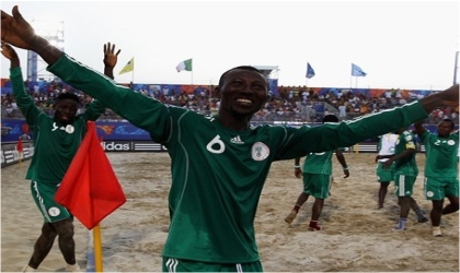 FRED07091103 Nigeria’s Sand Eagles celebrating their quarter final ticket in Italy, yesterday.