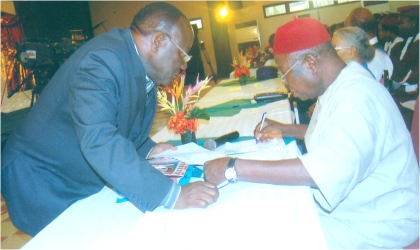 FRED14091102 Prof. Okafor Richard (right) discussing with Prof Dan Agu, during the Rivers State choral competition orgainsed by Nigeria Liquefied Natural Gas at Hotel Presidential, Port Harcourt, yesterday.