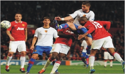 Ashley Young of Manchester United (18) scoring their third goal with a header during the UEFA Champions League