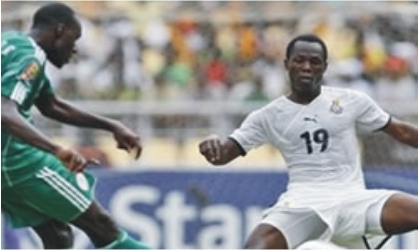 FRED10121103 Super Eagles player (left) in a tango with Black Stars player yesterday at Vicarage during an international friendly match. The game ended 0-0