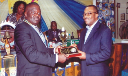 FRED19101102 President Rotary Club of Port Harcourt 2011/2012 District 9140, Rtn Dominic Okafor (left) presenting Rotary Club Meritorious Award to Mr Celestine Ogolo, General Manager, Rivers State Newspaper Corporation in Port Harcourt, last Monday. Photo; Chris Monyanaga