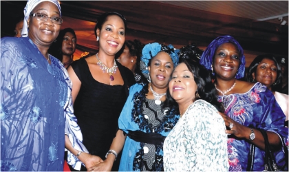 FRED21101102 First Lady, Dame Patience Jonathan (middle), flanked by Uche Ekwunife (right ), Nkiru Onyejiocha (left) and other National Assembly women members during a dinner party in Abuja, on Wednesday.