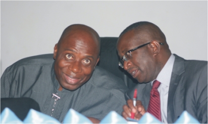 FRED26101101 Rivers State Governor, Rt Hon Chibuike Amaechi (left) chatting with Senate Leader, Senator Victor Ndoma-Egba, during the colloquium on the Supreme Court judgement that brought the governor to power in 2007 in Port Harcourt, yesterday