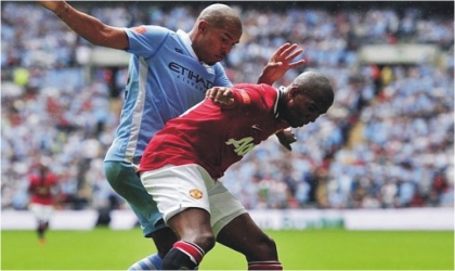 Man City player contesting the ball with Man United player in  last Sunday’s premiership game. Man City won 6-1