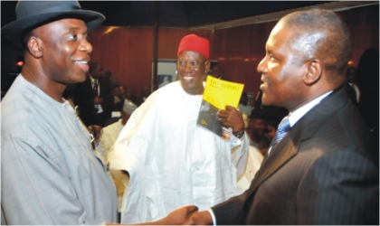 L-R: Rivers State Governor, Rt. Hon. Chibuike Amaechi in a handshake with President, Dangote Group, Alhaji Aliko Dangote, while Deputy Governor of Kano State, Alhaji Abdullai Gwarzo watches, during the 7th Nigerian Economic Summit in Abuja, yesterday.