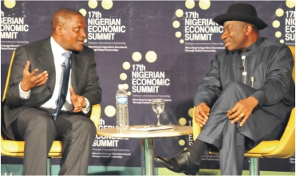 FRED14111101 President Goodluck Jonathan (right) with Chairman, Dangote Group, Alhaji Aliko Dangote during the 17th Nigerian Economic Summit in Abuja, last Thursday.