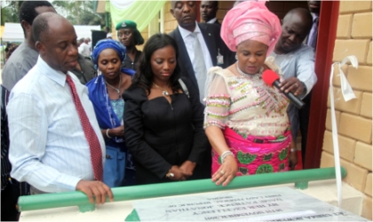 FRED21111101 First Lady, Dame Patience Jonathan (right) commissioning an Empowerment Support Initiative(ESI) model nursery school while Rivers State Governor, Rt. Hon. Chibuike Rotimi Amaechi (left) and his wife, Founder of ESI, Judith watch, in Ubima, Rivers State, over the weekend.