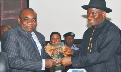 President Goodluck Jonathan (right), presenting a plaque to Chief Justice of the Republic of Gambia, Justice Emmanuel Akomaye-Agim, during the 2011 All Nigeria Judges’ Conference in Abuja, Monday.
