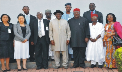 President Goodluck Jonathan (middle) with members of Presidential Technical Committee on Land Reform shortly after inauguration in Abuja, yesterday