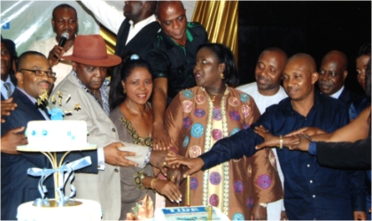 FRED05121101 Rivers State Commissioner of Information and Communications, Mrs Ibim Semenitari (middle) assisted by General Manager, RSNC, Mr Celestine Ogolo (left), member, House of Representatives, Hon. Ogbonna Nwuke (2nd left) and other dignitaries, cutting the 40th Anniversary Cake of the Rivers State Newspaper Corporation, during the Gala/Awards Nite, at Hotel Presidential, Port Harcourt, last Friday.