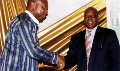 FRED05121102 Former Chief Executive Officer, Newswatch Magazine, Ray Ekpu (right) presenting an award to ED/CEO of Rivers State Sustainable Development Agency, Mr Noble Egberi Pepple, during the 40th Anniversary of RSNC, Gala/Award Nite at Hotel Presidential, Port Harcourt, last Friday.