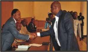 Secretary to the Rivers State Government, Mr. George Feyii (left), congratulating Hon. Dike Chikodi, after his swearing-in as Caretaker Committee Chairman of Obio/Akpor Local Government Area at Government House, Port Harcourt, yesterday.