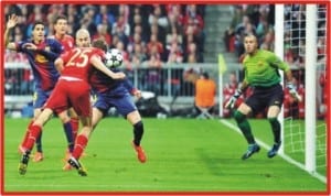 Tomas Mueller (25) heading home Bayern Munichs first goal against Barca, yesterday.