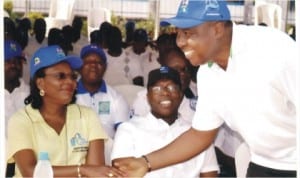 Executive Director, Rivers State Sustainable Development Agency (RSSDA), Mr Noble Pepple (right) in handshake with the Sole Administrator, Greater Port Harcourt, Mrs Aleruchi Cookey-Gam at the walk 4 life, an RSSDA Initiative in Port Hrcourt, recently