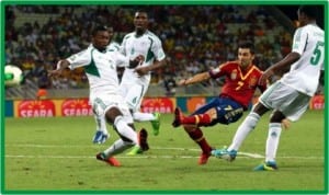Super Eagles defenders trying to stop Spain’s David Vila at the 2013 FIFA Confederaqtion Cup in Brazil.