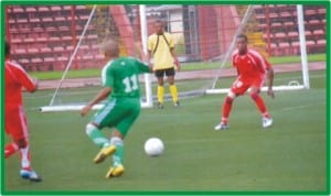 Government House player trying to beat the defence of Ministry of Special Duties in the final match of the HOS Cup , yesterday