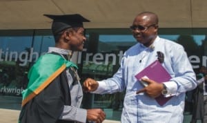 The Executive Director, Rivers State Sustainable Development Agency,  Noble Pepple (right), congratulating one of the beneficiaries of RSSDA scholarship during his graduation in a university  i n the UK recently.