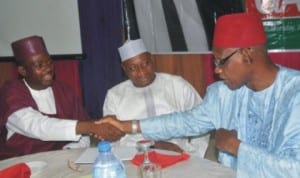 Minister of Information, Mr Labaran Maku (left), being welcomed by Kano State Commissioner for Education, Mr Faruk Iya, during the reception in honour of Mohammed Garba (middle), President, Federation of African Journalists, in Abuja last Thursday night.