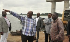 Rivers State Governor Rotimi Amaechi inspecting a section of the Ogoni-Andoni- Unity road been constructed by his administration, weekend. with him are some of his aides