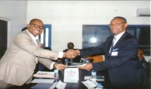 Executive Director, Rivers State Sustainable Development Agency (RSSDA), Mr Noble Pepple (left) presenting a Memorandum of Understanding to the Vice Chancellor, University of Port Harcourt, Prof Joseph Ajieneka, after signing, yesterday.
