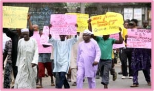 A faction of Mile One Rumuwoji Market Traders Association protesting the removal of their chairman in Port Harcourt last Wednesday