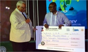 Associate Director, Global Engagement, University of Arkansas at Pine Bluff, United States of America, Dr Pamela D Moore (left), presenting the winner’s prize of three million naira  for the International Heritages Parade to the Chairman of Okrika Local Government Area, Barrister Tamuno Williams in Port Harcourt, yesterday Photo: Chris Monyanaga